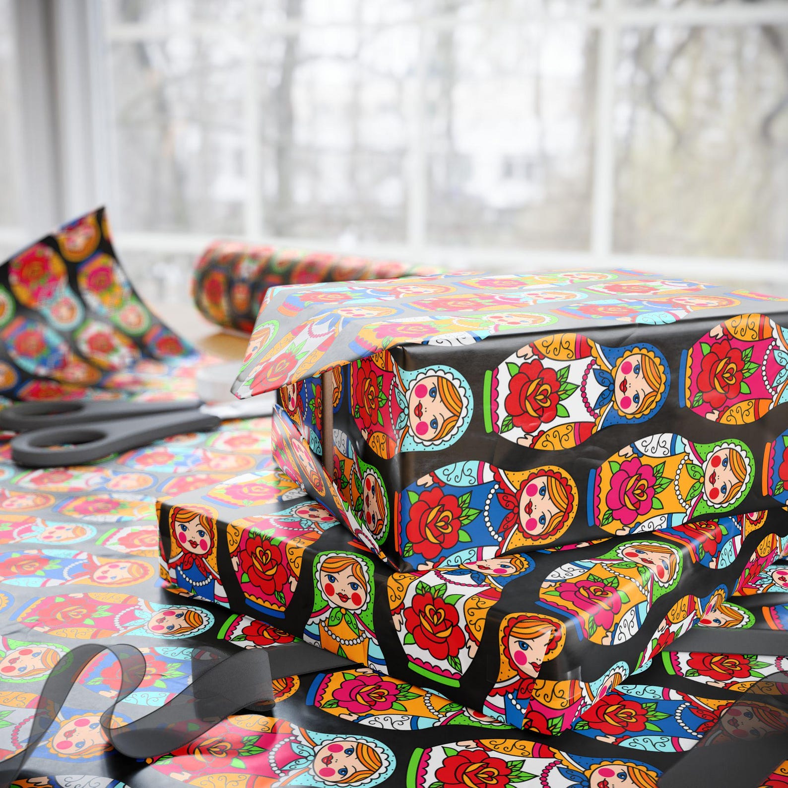 Gifts wrapped in black paper with colourful Russian nesting dolls and flowers